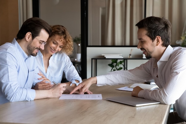 happy couple clients signing house buying rent contract insurance agreement filling bank papers mortgage loan meeting with lawyer broker realtor real estate agent office 656932 5126